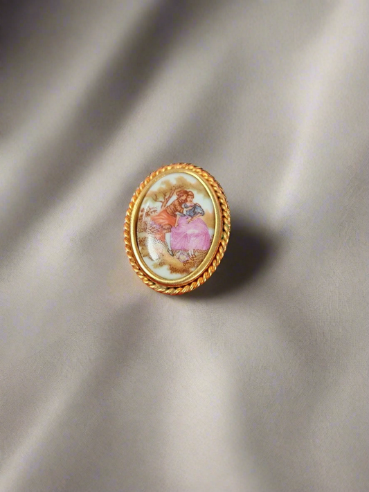 La reine limoges porcelain courting couple brooch